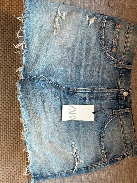 Zara Dresses & Skirts - NEW WITH TAGS Zara light-washed distressed blue denim mini skirt with frayed hem